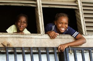 Faces At the Window in Beira 